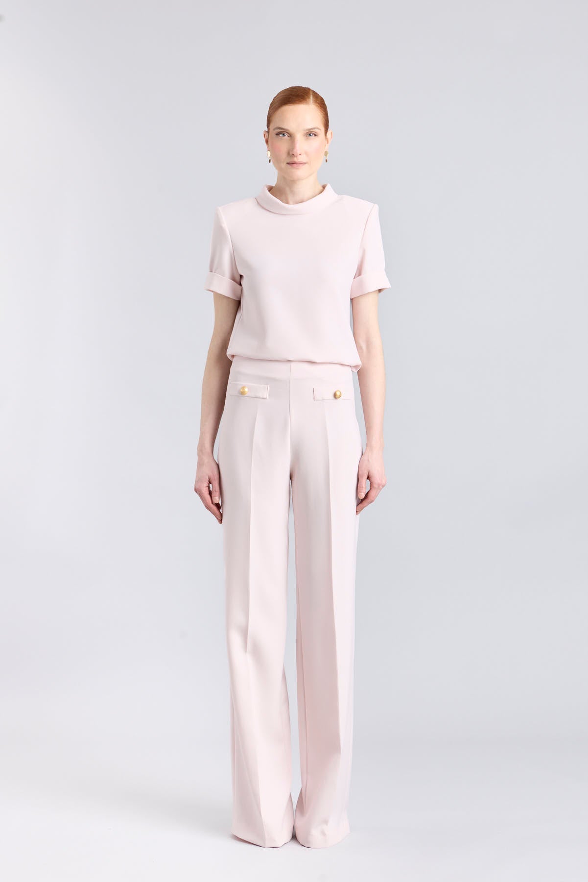 Top rosa de manga corta con cuello perkins de The Extreme Collection.